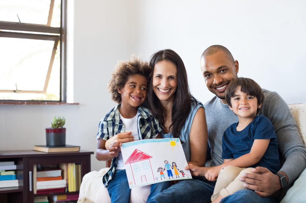 family sitting on couch